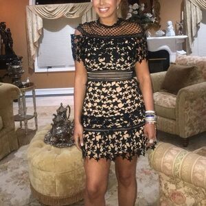 Beautiful black and nude dress with lace star details